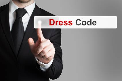 photo : businessman pushing button dress code