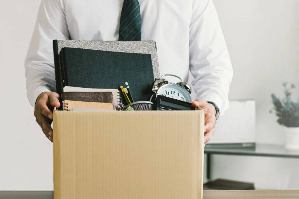 photo : Resignation. businessmen holding boxes for personal belongings a