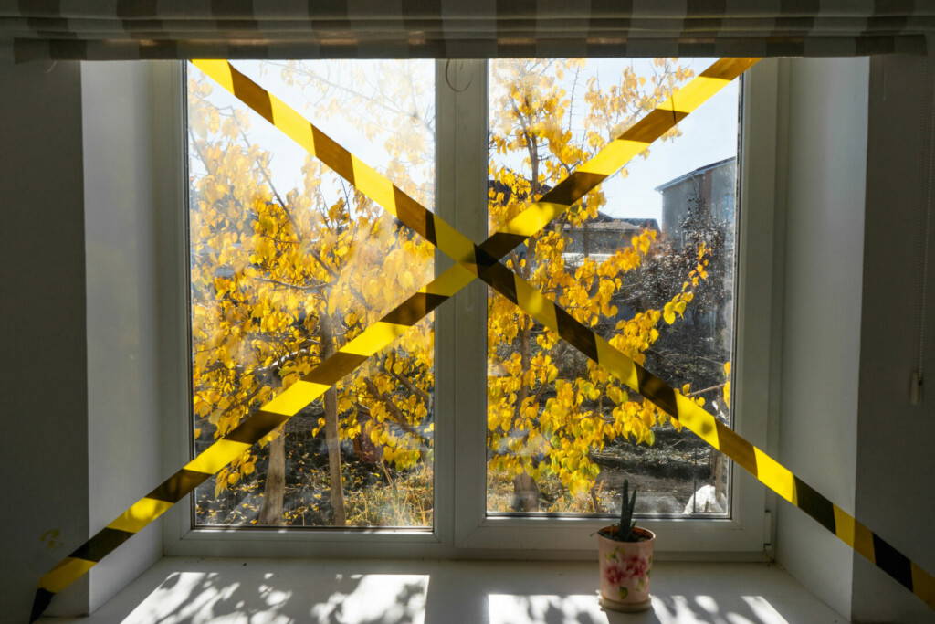 photo : urban environment is prohibited. view from the window. forbidden tape on the background. self-isolation due to the pandemic of the coronavirus COVID-19. Stay at home during the fall season